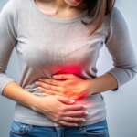 women feeling sudden strong abdominal stomach ache and gastritis problem