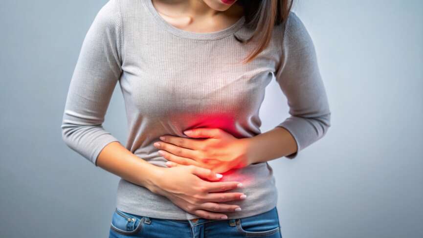 women feeling sudden strong abdominal stomach ache and gastritis problem