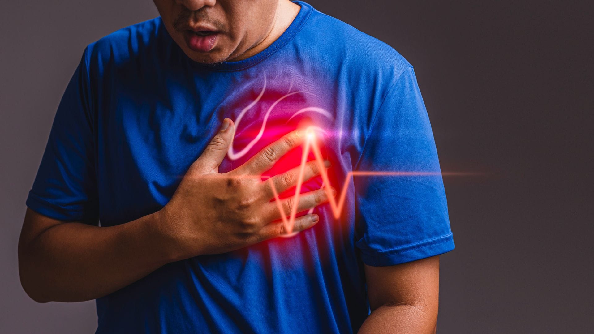 Man suffering from chest pain having heart attack or painful cramps