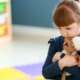 developmental screening for autism in a small girl sitting alone in classroom