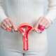 A girl holding a 3D anatomy model of vagina representing ovarian cancer
