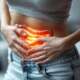 IBS triggers and symptoms shown in a woman with abdominal pain and bloating