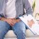 Doctor explaining untreated prostate cancer risks to a male patient