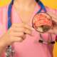 a medical nurse with a stethoscope and a close-up brain image of brain explaining meningitis, which is a serious inflammation of the protective membranes surrounding the brain and spinal cord, usually caused by viral or bacterial infections