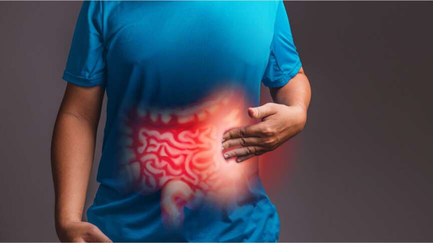 Internal digestive system with highlighted red inflammation on sick person, a man with stomach pain representing crohn's disease