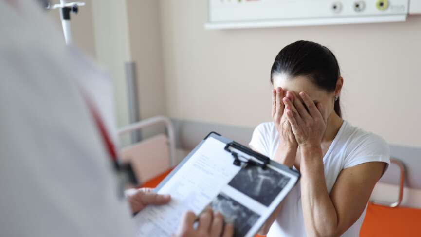 Desperate woman hearing the results of a pregnancy test and signs of infertility