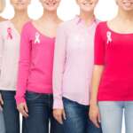 a group of female with pink ribbon breast cancer awareness concepts representing the types of breast cancer