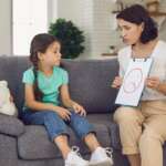 mom talking to daughter who is suffering from ADHD, supporting her at home representing adhd in females