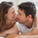 A relaxed couple resting together in bed and the concept is how to increase libido naturally