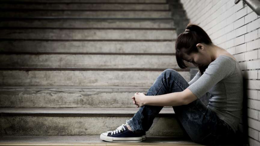 Depressed young woman with atypical depression