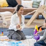 mother performing ABA therapy for her autism son