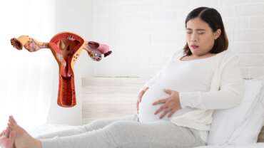 pregnant woman with her stomach due to endometriosis pain