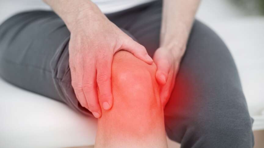 A man suffering from knee ache due to extreme osteoarthritis pain