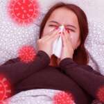 A young sick woman blowing her nose due to Allergic rhinitis