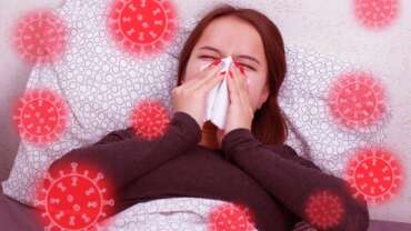 A young sick woman blowing her nose due to Allergic rhinitis