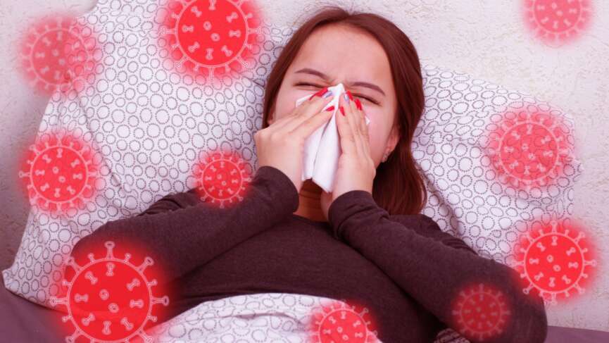 A young sick woman blowing her nose due to Allergic rhinitis