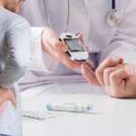 finger for blood test of sugar level and a man with kidney ache