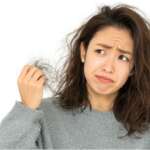 face of sad girl frustrated with weak split ends and hair fall. iron deficiency and skin changes concept