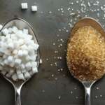 Natural vs Artificial Sweeteners concept displaying in spoon