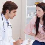 Doctor nutritionist takes a patient with foodborne illness in the office for proper checkup