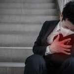 Young man having chest pain and heart health due to stress concept