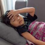 sick child with fever at home kid with iron deficiency in children concept