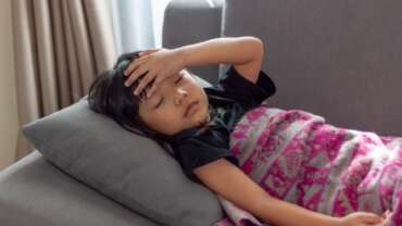 sick child with fever at home kid with iron deficiency in children concept