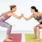 A young beautiful sporty girl performing gym exercises for weight loss