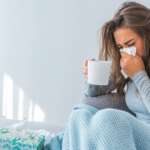 A girl with the flu is staying at home. cure cold at home concept