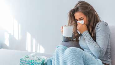 A girl with the flu is staying at home. cure cold at home concept