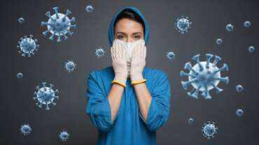 Close up of woman in mask. Preventing infections concept