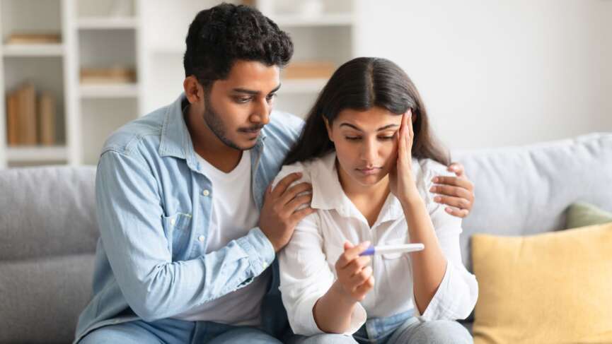 A worried young couple looking at a negative test. Foods that affects ovulation and sperm quality concept
