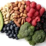 a group of healthy foods for brain power, such as berries, walnuts, broccoli, and avocado