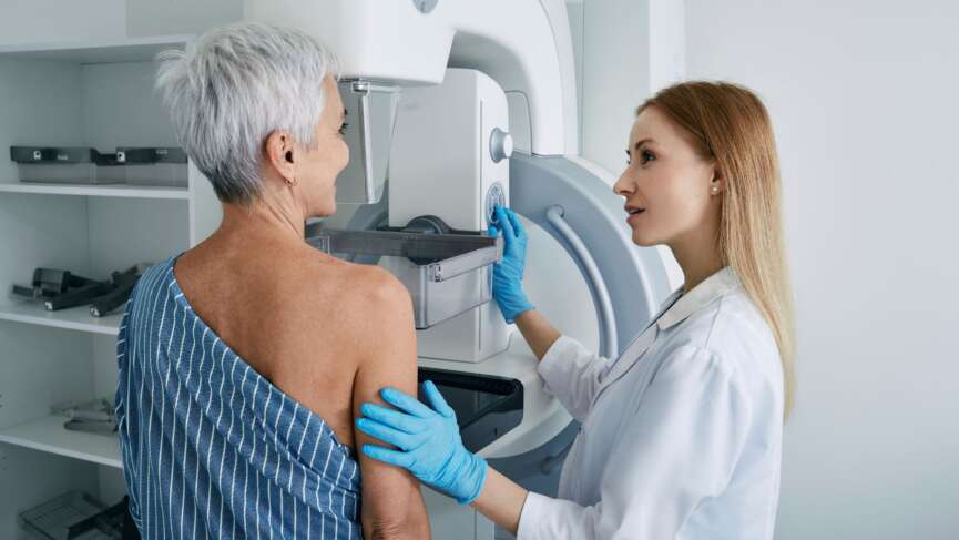 shot of a mature woman being comforted by a doctor before cancer screening and test