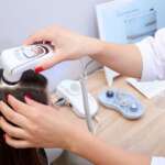 Microscopic examination of the hair and skin of the scalp. Concept, laser therapy for hair loss