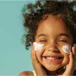 Sunscreen on the skin of a child. Concept Should kids use sunscreen or not?