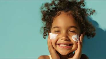 Sunscreen on the skin of a child. Concept Should kids use sunscreen or not?