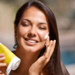 A portrait smile and a white woman with sunscreen on her face to protect her skin using SPF treatment concept, different SPF sunscreens