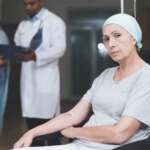 a woman with cancer and her daughter speaking with a doctor about food and cancer myths and treatment information