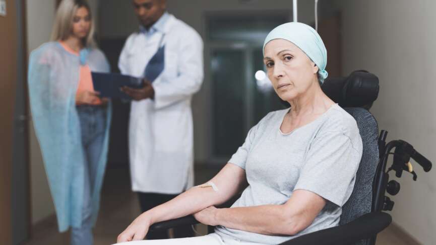 a woman with cancer and her daughter speaking with a doctor about food and cancer myths and treatment information