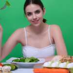 anti-inflammatory diet concept where a woman eats vegetables for weight loss and detox diet healthy food