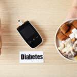 woman holding apple plate with sweets near digital glucometer representing diabetes myths, insulin resistance and modern diabetes treatment concept